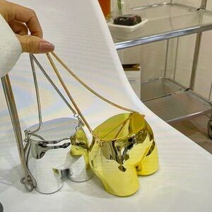 Caleesa Gold AND Silver Metallic Bags in the Image of a Lower Torso, NWOT
